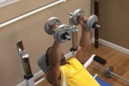 0 picture of man doing inclined dumbell press
