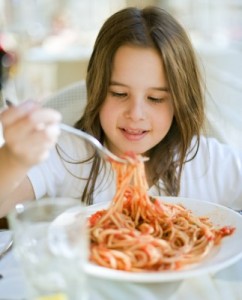 picture of girl eating pasta