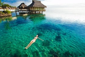 picture of woman floating in the caribbean water