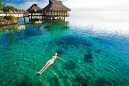 picture of woman floating in the caribbean water picture of woman floating in the caribbean water