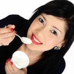 picture of woman eating yoghurt
