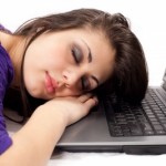 picture of woman sleeping on laptop