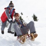 picture of father and son sledding