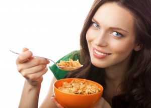picture of woman eating cornflakes