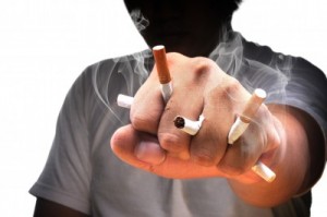 picture of A man fist full with cigarette with isolated white background 