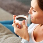 picture of Closeup portrait of beautiful young lady enjoying black coffee at home 