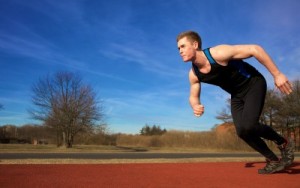 picture of Young runner starting to sprint in park