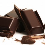 picture of broken plain chocolate pieces on white background