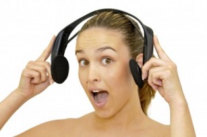 picture of happy young girl with headset listening to music isolated in white