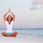 picture of yoga woman on sea coast